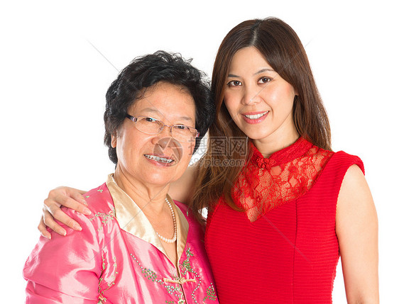 亚洲高龄母亲和成年女儿成人旗袍节日后代家庭快乐文化父母女性传统图片