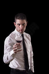 男人拿着红酒的红酒杯工作室玻璃白色饮料酒精商业套装管理人员男性黑色图片