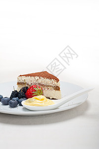 甜点加浆果和奶油巧克力宏观糕点蛋糕美食小吃咖啡食物粉末图层图片