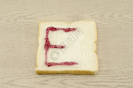 切片面包上的果酱字母表早餐营养午餐小吃面包师面团美食厨房谷物脆皮图片