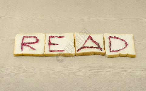 切片面包上的果酱字母表小吃饮食厨房午餐碳水早餐食物脆皮谷物面包师图片