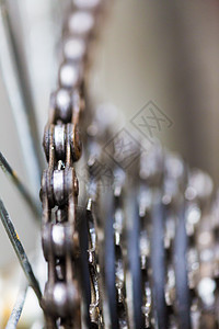 自行车链的紧闭金属链式宏观齿轮自行车车轮技术驾驶牙齿车辆图片