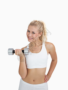 年轻女子用哑铃锻炼的肖像活力力量头发重量运动训练女士浅色幸福身体图片