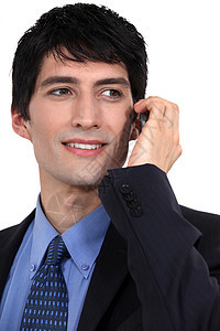 使用移动电话的青年成功商业青年的成功商务人士图片