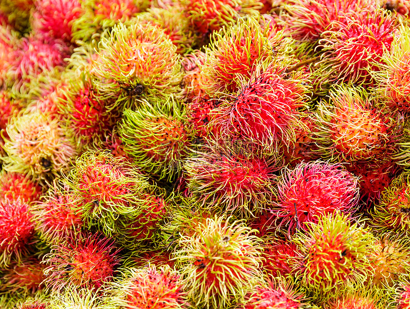 红布丁收成热带红色水果市场图片