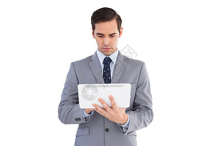 拥有平板电脑的商务人士商业夹克套装公司人士专注男人触摸屏男性商务图片