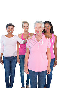 身着粉色顶部和乳腺癌丝带的支助妇女图片