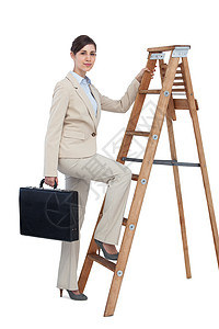 商业妇女用公文包和看一看 攀上职业阶梯图片