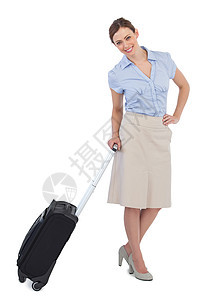 携带手提箱的勤奋 优雅的女商务人士图片