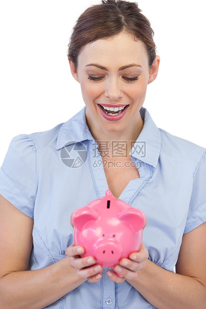 以小猪银行为幌子的令人惊讶的商业女商务人士图片