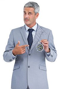 持闹钟的商务人士头发商务套装时间人士公司手指衬衫商业领带图片