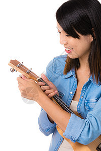 亚裔妇女调音ukelele图片