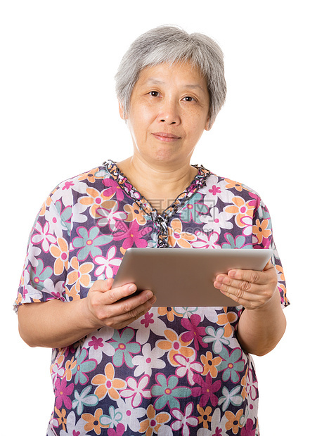 亚洲老年妇女使用数字平板电脑老人退休药片技术女人老女人白色男人老太婆图片