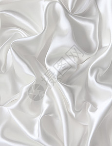 作为婚礼背景的平滑优雅白色丝绸折痕材料银色投标曲线织物海浪涟漪新娘布料图片
