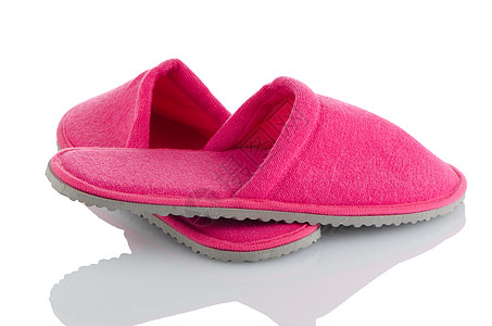 一对粉红色拖鞋毛毡寒意房子卧室时间旅行浴室鞋类家居用品背景图片