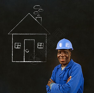 非洲黑人工人 有粉笔屋背景的非洲黑人工人工匠职场黑板男人建造住宅劳动生产工艺工作服图片