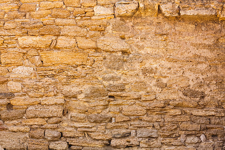 Grungy石墙废墟框架石头历史房子建筑学砂岩材料岩石水泥图片