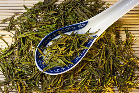 中国绿色茶花茶茉莉饮料勺子珍珠灯泡背景图片