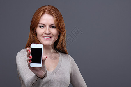 美丽的年轻女子女孩广告电话技术女性红发营销工作室手机女士图片