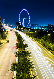 新加坡市夜间传单景观摩天大楼天际城市天空轨迹摩天轮车轮红绿灯图片