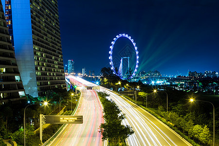 新加坡城市风景摩天大楼摩天轮城市传单红绿灯车轮轨迹天空天际交通图片