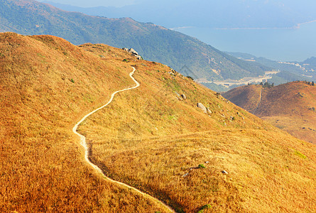 山区之路草地爬坡稻草高地植物石径石头人行道路径岩石图片