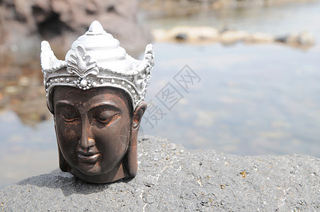 佛像雕像假期祝福冥想岩石上帝海滩支撑金子海岸塑像图片