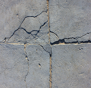 带裂缝的水泥墙历史韧性宏观材料苦恼岩石地面石膏损害建造图片