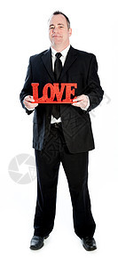 演播室拍到的爱人年轻人商务白色幸福恋爱红色微笑套装男性商业图片