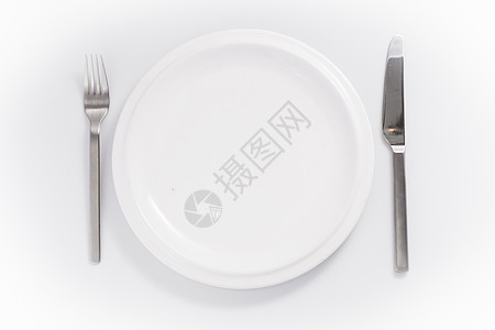 在白色背景上隔离的餐具和瓷器圆形刀叉盘子刀具图片