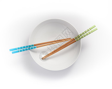 空碗中的筷子 在白色背景上被孤立餐具绿色背景图片