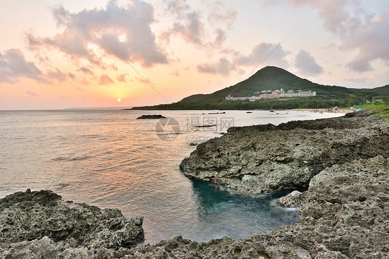 珊瑚海岸线日落风景地平线船帆天空旅行海岸地标岩石海浪国家图片