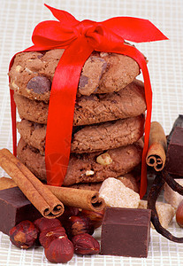 圣诞饼干饮食甜食领结丝带红带食物棕色巧克力红色饰品图片