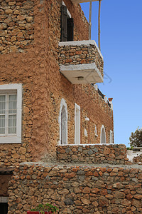 传统希腊族住房村庄天空黏土岩石建筑栏杆阳台楼梯窗户瓷砖图片