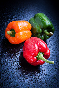贝尔胡椒红色蔬菜蓝色选择性饮食橙子水滴橙色背景食物图片