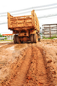 倾储器卡车挖掘机机器搬运工建筑机械装载机拖拉机建造倾倒图片