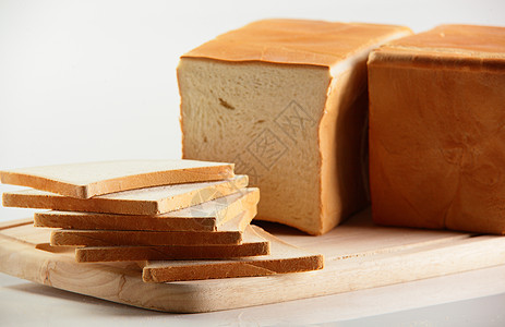 白背景的美味面包美食棕色白色饮食谷物食物黄色面粉粮食脆皮图片