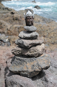 佛像雕像雕塑岩石假期海滩海岸金子石头上帝支撑佛教徒图片