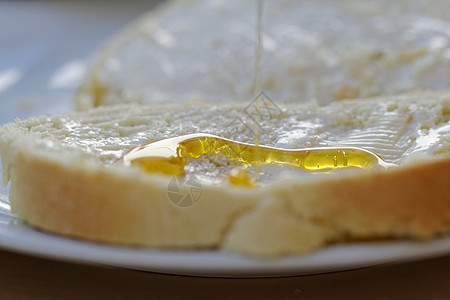 面包和蜂蜜小吃饮食早餐黄色宏观午餐白色小麦黄油营养图片