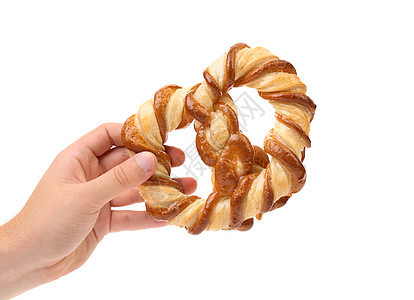 手握着结结状的饼干面包师小麦营养脆皮结状早餐食物小吃糕点面包图片