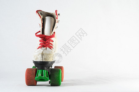 消耗的滚式滑板运动滑冰鞋带旱冰皮革乐趣轮子孩子孩子们闲暇图片
