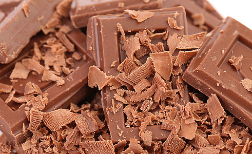 巧克力贴上巧克力块卷曲糖果诱惑粉末甜点薄片牛奶可可乐趣正方形图片
