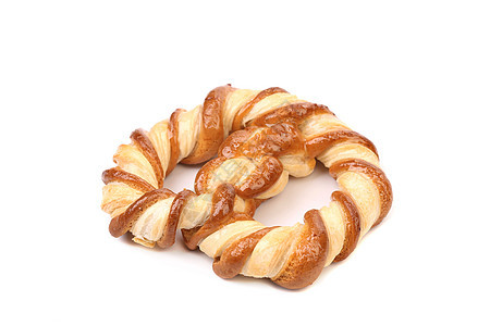 白色背景上的 Knot 形状饼干食物盐渍面包师食品脆皮面包小吃营养包子早餐图片