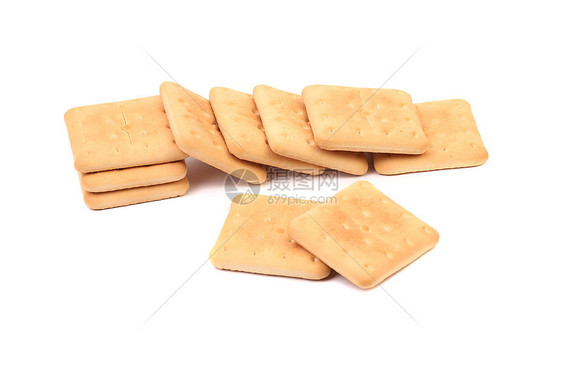 孤立在白色上的盐碱苏打饼干小吃宏观赌注正方形盐渍棕色面包黄色长方形饮食图片