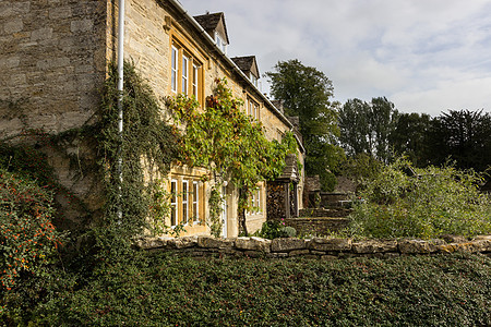 英格兰Cotswold区老房子房屋英语戏剧性小屋历史性石头街道围墙花园旅游图片