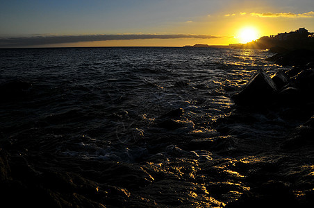 大西洋上空的日落地平线海岸海岸线橙子城市海洋太阳天空支撑海滩图片