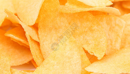 土豆薯片的背景摄影筹码锯齿状工作室润滑脂食物营养育肥黄色通灵图片
