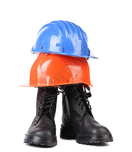 坚硬的帽子和工作靴子个人塑料黑色防护衣服头盔齿轮装备工具预防图片