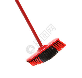 红色黑扫帚贴近了清洁工黑色地面房子家务工具拖把白色塑料灰尘图片