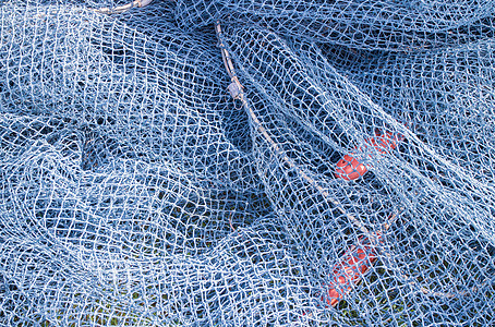 渔网和绳索旅行渔夫支撑尼龙齿轮海鲜蓝色港口塑料拖网图片